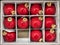 Red Christmas balls in a box in a supermarket top view, Christmas decorations on a showcase