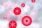 Red Christmas balls over abstract festive delicate winter christmas or New Year background texture with shiny light blue pink and
