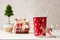 Red Christmas cup and festive wooden decor