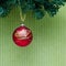 Red christmas decoration on the branch of artificial christmas t