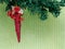 Red christmas decoration on the branch of artificial christmas t