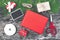 Red Christmas gift boxes and small present set preparing handmade decoration paper, white ribbon, rope, scissors and blank black