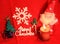 Red Christmas: Santa and Christmas tree and gifts in red background