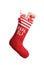 Red Christmas stocking full of gift boxes on white background.