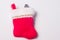 Red Christmas stocking with Lump of coal sticking