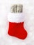 Red Christmas Stocking Stuffed with Hundred Dollar Bills