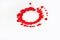 A red circle drips onto a spinning white background.