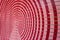 The red circular background is interspersed with beautifully dimensional looking pink.