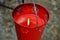 Red citronella candle bucket