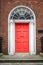 Red classic door in Dublin, example of georgian typical architecture of Dublin Ireland