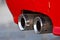 Red classic sport car exhaust close up