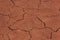 Red clay cracks because of lack of water