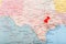 Red clerical needle on a map of USA, Texas and the capital Austin. Closeup Map Texas with Red Tack