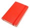 Red closed paper notepad on white