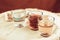 On a red cloth background there are three glasses with alcohol and old money of the Soviet Union of the Soviet period, the life of