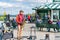 Red cloth man playing saxophone under the Monument Samuel-De Champlain