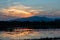 red cloud at dusk in the silhouette mountain and swamp