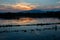 red cloud at dusk in the silhouette mountain and swamp