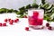 Red cocktail with cherry and ice on a white wooden background. Fresh summer cocktail with cherries and ice cubes