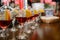 Red cocktail with lemon and orange standing on a table in the bar