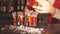 Red cocktail shots in glass isolated on blurred restaurant background