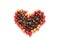 Red coffee beans berries and roasted coffee in heart shape.