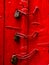 Red color door with three locks aligned together in Old Delhi Streets, Old Delhi Street photography Delhi India