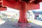 red color metallic road bridge pillars of access to holy infant avenue in Lisbon, cross the avenue July 24