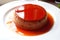 Red color pudding on the table. Caramel coffee pudding ready to eat. Delicious pudding.