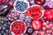 Red color and purple fruits and vegetables background top view.