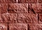 Red color stylized brick wall pattern.