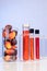 Red color unrefined palm oil and fruits with beaker test tube in laboratory