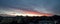 Red colored cirrostratus cloud, sunset landscape panorama