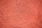 Red colored plaster wall background