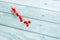 Red Colored Vitamins Pills on Wooden Background. Soft focused. Shallow depth of field