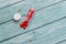 Red Colored Vitamins Pills on Wooden Background. Soft focused. Shallow depth of field