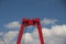 Red colored Willemsbrug over river Nieuwe Maas in Rotterdam, the Netherlands.