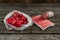 Red colors picture, fresh radish, crab sticks and sausage isolated on the wooden background