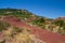 Red coloured geological layers near Lac du Salagou in southern France