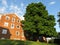 Red Condominium and Pretty Green Tree