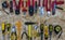 Red construction tools opposite yellow working tools on a osb background.