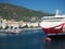 Red Corsican ferry boat with view on Livorno Italy harbor