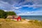 Red cottage house at the beach of Baltic sea