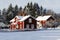 Red cottages, farm in snowy winter scenery
