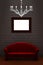 Red couch with empty frame and luxury chandelier