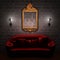 Red couch with empty frame and sconces