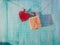 red country fabric hearts hanging on clothesline with rustic wood door Valentines Day, Mothers Day, and love concept background wi