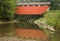 Red Covered Bridge Over a Stream