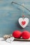 Red crocheted easter eggs in a shabby wooden box