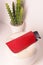 red crocodile leather eyeglass case closeup photo on white wall background